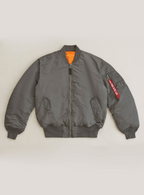 A gray Alpha MA-1 Bomber Jacket with a zipper front, utility pockets, and a knit rib collar, cuffs, and waistband.