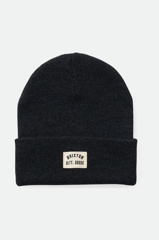 A black fisherman's beanie with a thick cuff and a small white label on the front that reads 'Brixton QLTY GOODS'.